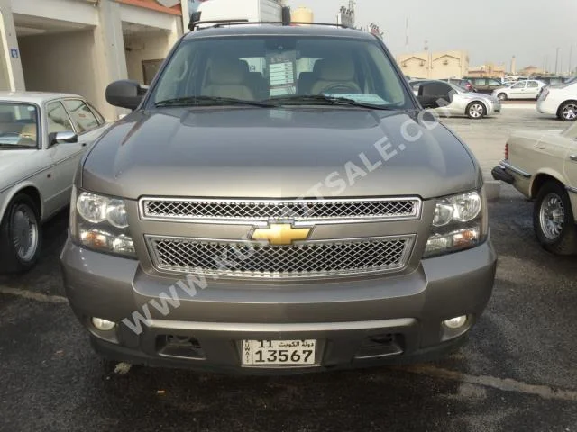 Chevrolet  LT  Tahoe  2012  124,000  SUV  Automatic  8  Cloth  4WD  Gold  Gasoline