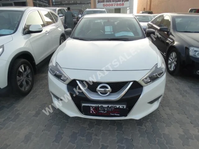 Nissan  Maxima  2016  13,000  Sedan  Automatic  6  Cloth  RWD  White  Gasoline