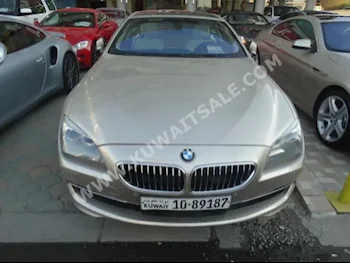 بي ام دبليو  640i  الفئة - السادسة  2012  110,000  كوبيه \ سبورت  اتوماتك  6  جلد  دفع خلفي  ذهبي  بنزين