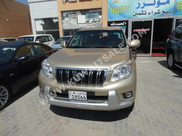 Toyota  TX.L  Prado  2010  220,000  SUV  Automatic  6  Cloth  4WD  Gold  Gasoline