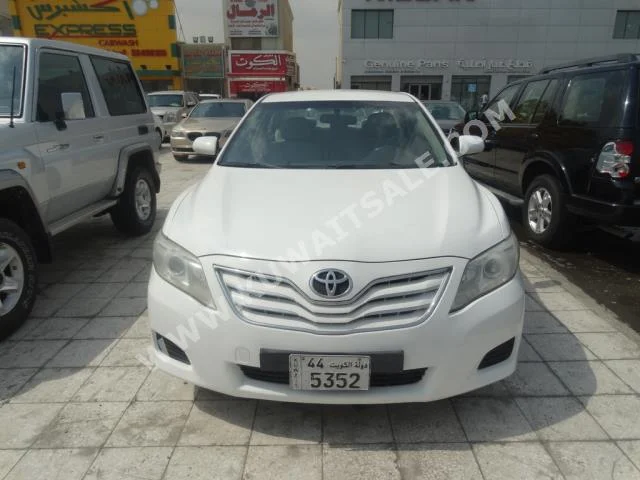 Toyota  GL  Camry  2010  185,000  Sedan  Automatic  4  Cloth  FWD  White  Gasoline