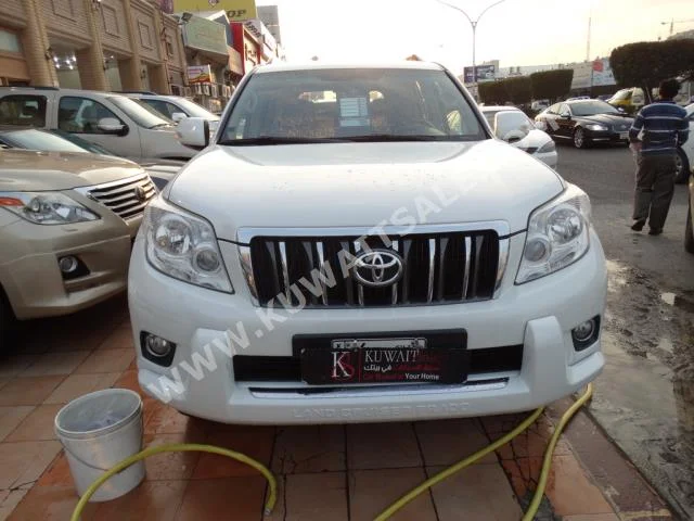 Toyota  TXL  Prado  2011  96,000  SUV  Automatic  6  Cloth  4WD  White  Gasoline