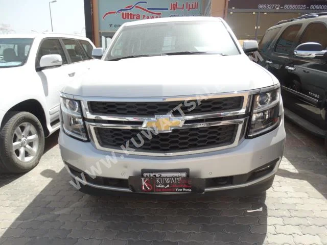 Chevrolet  LS  Tahoe  2015  65,000  SUV  Automatic  8  Cloth  4WD  Silver  Gasoline