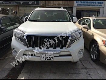 Toyota  TXL  Prado  2015  40,000  SUV  Automatic  6  Cloth  4WD  White  Gasoline