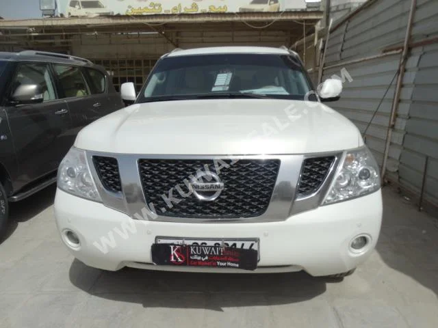 Nissan  SE  Patrol  2013  84,000  SUV  Automatic  8  Cloth  4WD  White  Gasoline