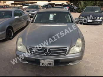 Mercedes-Benz  500  CLS-Class  2009  163,000  Sedan  Automatic  6  Leather  RWD  Gold  Gasoline