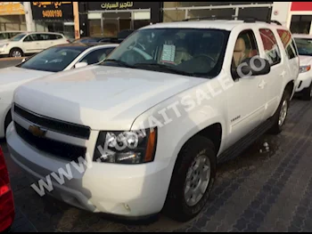 Chevrolet  LT  Tahoe  2014  98,000  SUV  Automatic  8  Cloth  RWD  White  Gasoline