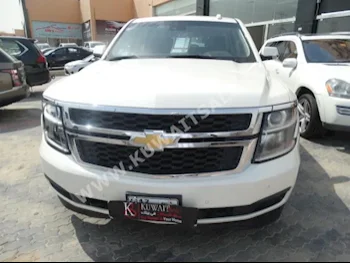 Chevrolet  LT  Tahoe  2015  100,000  SUV  Automatic  8  Leather  4WD  White  Gasoline