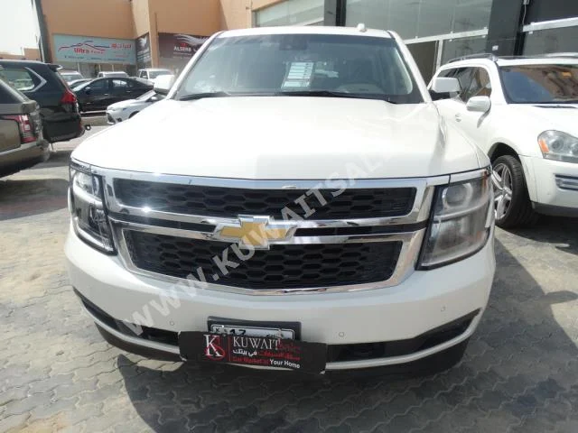 شفروليه  ال تي  تاهو  2015  100,000  اس يو في  اتوماتك  8  جلد  دفع رباعي  أبيض  بنزين