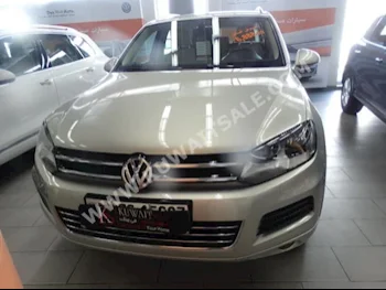 Volkswagen  Touareg  2014  6,888  SUV  Automatic  6  Leather  RWD  Gold  Gasoline