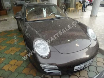 Porsche  Carrera 4S  911  2009  140,000  Coupe / Sport  Automatic  6  Leather  RWD  Bronze  Gasoline
