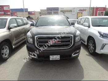 GMC  SLE  Yukon  2016  30,000  SUV  Automatic  8  Cloth  4WD  Brown  Gasoline