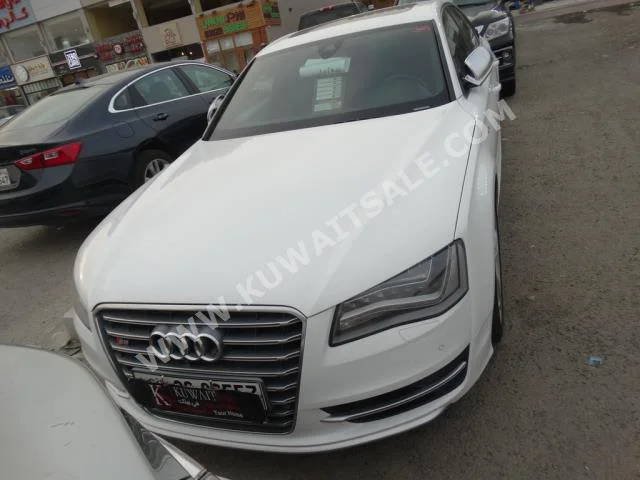 Audi  8  S  2013  102,000  Sedan  Automatic  8  Leather  RWD  White  Gasoline