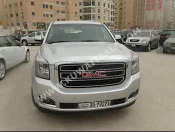 GMC  Yukon  2015  70,000  SUV  Automatic  8  Cloth  RWD  Silver  Gasoline