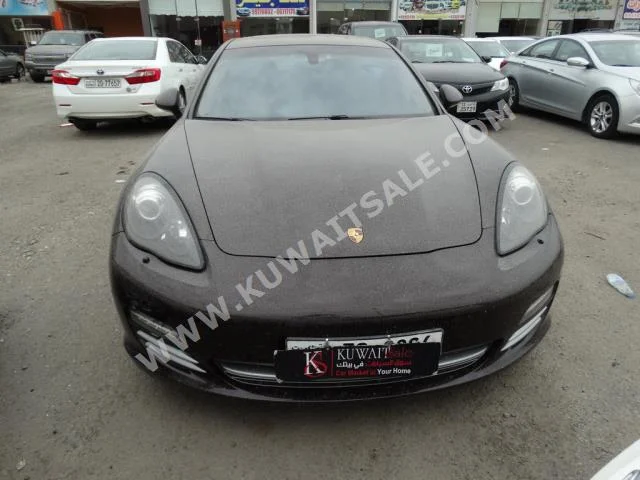 بورش  بانميرا  2013  50,000  سيدان  اتوماتك  6  جلد  دفع خلفي  بني  بنزين