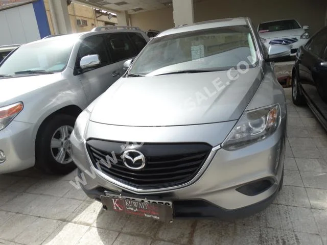 Mazda  9  CX  2013  48,000  SUV  Automatic  6  Cloth  RWD  Silver  Gasoline