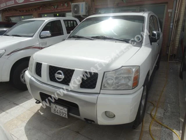 Nissan  Armada  2005  175,000  SUV  Automatic  8  Cloth  4WD  White  Gasoline