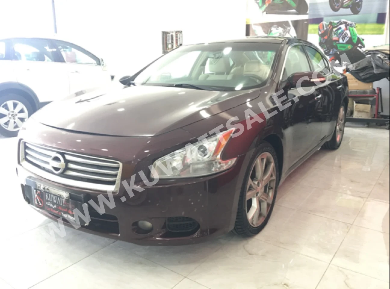 Nissan  Maxima  2013  94,000  Sedan  Automatic  6  Cloth  FWD  Maroon  Gasoline