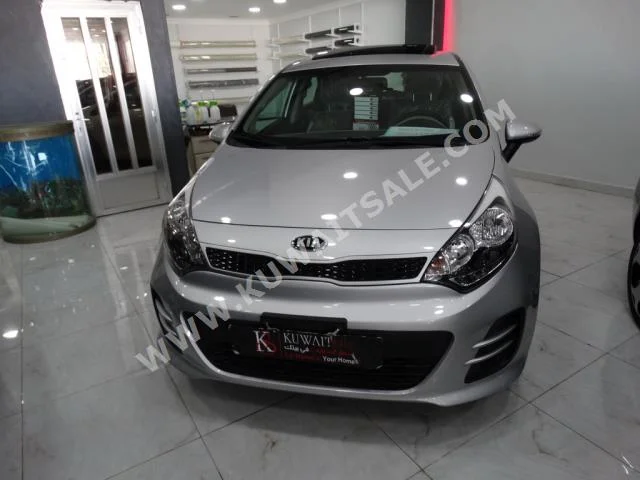 Kia  Rio  2015  0  Hatchback  Automatic  4  Cloth  FWD  Silver  Gasoline