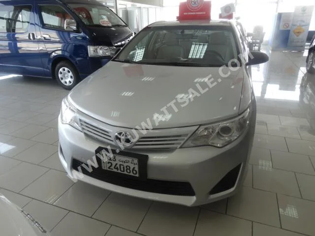 Toyota  GL  Camry  2015  79,000  Sedan  Automatic  4  Cloth  FWD  Silver  Gasoline