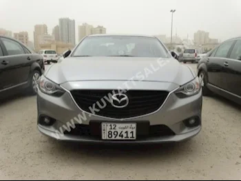Mazda  Mazda 6  2014  80,000  Sedan  Automatic  6  Cloth  4WD  Silver  Gasoline