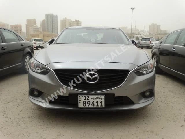 Mazda  Mazda 6  2014  80,000  Sedan  Automatic  6  Cloth  4WD  Silver  Gasoline