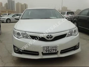 Toyota  GLX  Camry  2013  50,000  Sedan  Automatic  4  Cloth  FWD  White  Gasoline