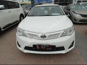 Toyota  GL  Camry  2014  74,000  Sedan  Automatic  4  Cloth  FWD  White  Gasoline