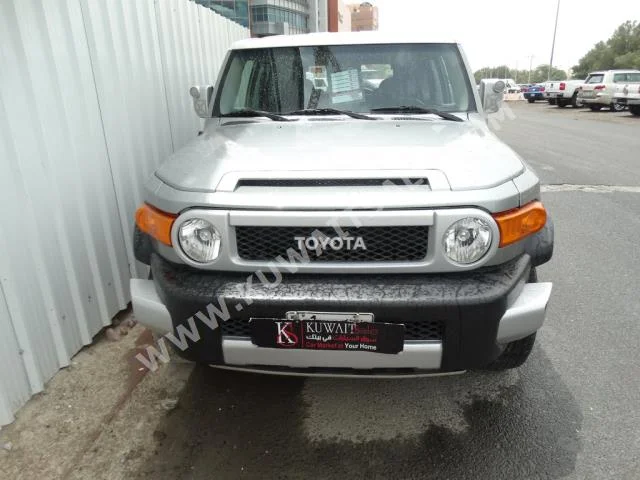 Toyota  FJ Cruiser  2010  140,000  SUV  Automatic  6  Cloth  4WD  Silver  Gasoline