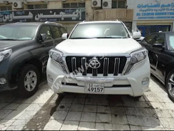 Toyota  TXL  Prado  2015  40,000  SUV  Automatic  6  Cloth  4WD  White  Gasoline