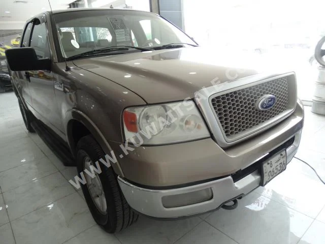 Ford  150  F  2004  257,000  Pick Up  Automatic  8  Cloth  4WD  Gold  Gasoline