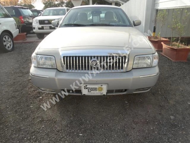 Ford  Grand Marquis  2006  125,000  Sedan  Automatic  8  Cloth  RWD  Gold  Gasoline