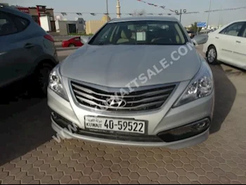 Hyundai  Azera  2016  50,000  Sedan  Automatic  6  Cloth  FWD  Silver  Gasoline
