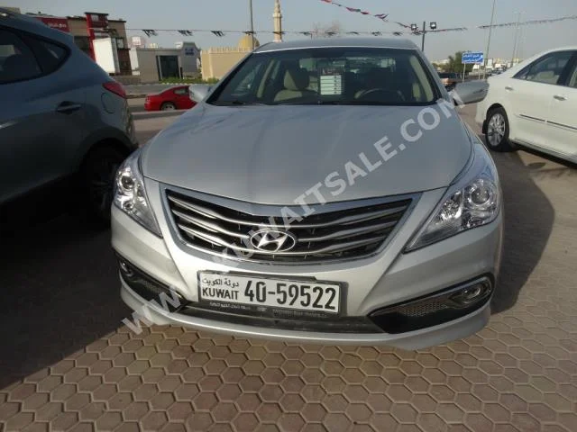 Hyundai  Azera  2016  50,000  Sedan  Automatic  6  Cloth  FWD  Silver  Gasoline