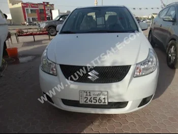 Suzuki  SX4  2014  28,000  Sedan  Automatic  4  Cloth  FWD  White  Gasoline