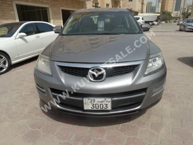 Mazda  9  CX  2009  163,000  SUV  Automatic  6  Cloth  RWD  Silver  Gasoline