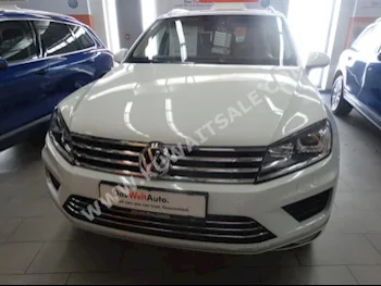 Volkswagen  Touareg  2016  42,000  SUV  Automatic  6  Leather  4WD  White  Gasoline
