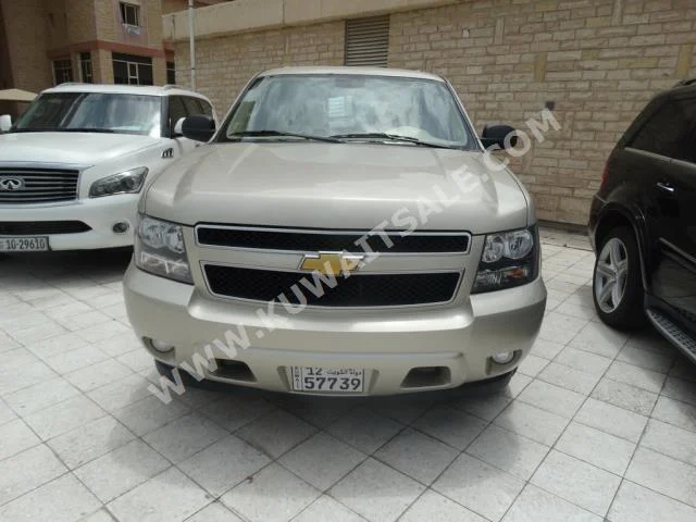 Chevrolet  LT  Suburban  2013  14,000  SUV  Automatic  8  Cloth  4WD  Gold  Gasoline