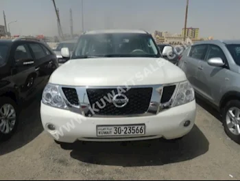Nissan  SE  Patrol  2013  122,000  SUV  Automatic  8  Cloth  4WD  White  Gasoline
