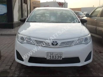 Toyota  GL  Camry  2014  109,000  Sedan  Automatic  4  Cloth  FWD  White  Gasoline