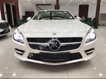 مرسيدس - بنز  500 AMG  اس ال - كلاس  2013  42,000  كوبيه \ سبورت  اتوماتك  8  جلد  دفع خلفي  أبيض  بنزين