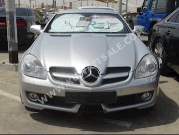Mercedes-Benz  200  SLK-Class  2009  98,000  Coupe / Sport  Automatic  4  Leather  RWD  Silver  Gasoline