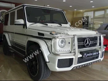 Mercedes-Benz  63 AMG  G-Class  2013  100,000  SUV  Automatic  8  Leather  4WD  White  Gasoline