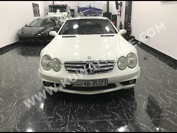 مرسيدس - بنز  55 AMG  سي ال - كلاس  2004  81,000  كوبيه \ سبورت  اتوماتك  6  جلد  دفع خلفي  أبيض  بنزين