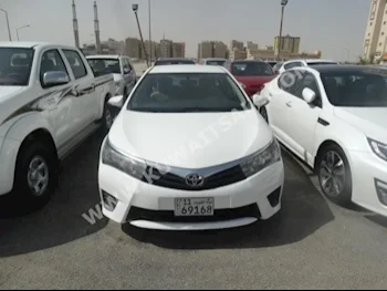 Toyota  XLI  Corolla  2014  73,000  Sedan  Automatic  4  Cloth  FWD  White  Gasoline