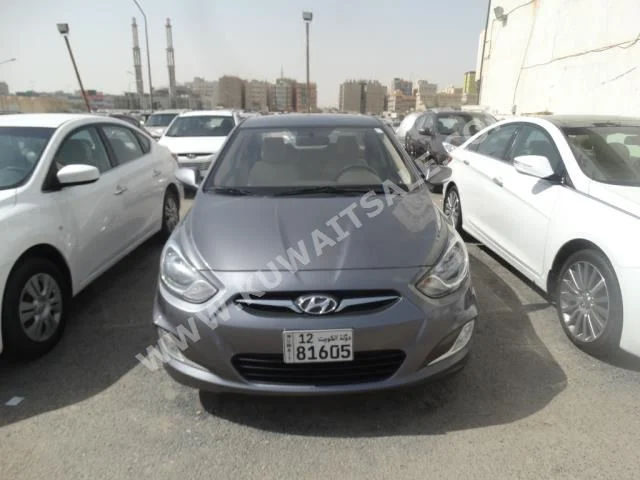Hyundai  Accent  2015  58,000  Sedan  Automatic  4  Cloth  FWD  Gray  Gasoline