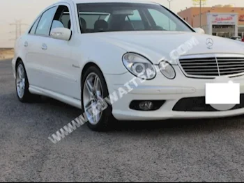 مرسيدس - بنز  55 AMG  اي - كلاس  2006  77  سيدان  اتوماتك  8  جلد  دفع خلفي  أبيض  بنزين