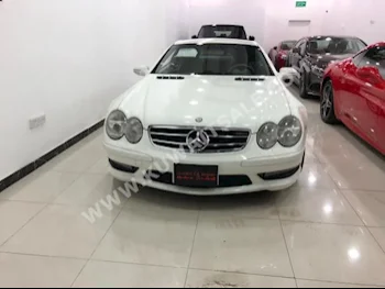 مرسيدس - بنز  500  اس ال - كلاس  2002  100,000  كوبيه \ سبورت  اتوماتك  8  جلد  دفع خلفي  أبيض  بنزين