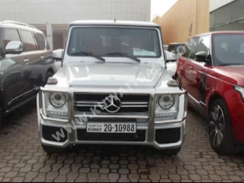 Mercedes-Benz  55 AMG  G-Class  2012  100,000  SUV  Automatic  8  Leather  4WD  Silver  Gasoline