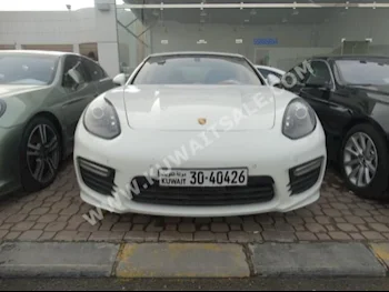 Porsche  GTS  Panamera  2014  58,000  Sedan  Automatic  8  Leather  RWD  White  Gasoline